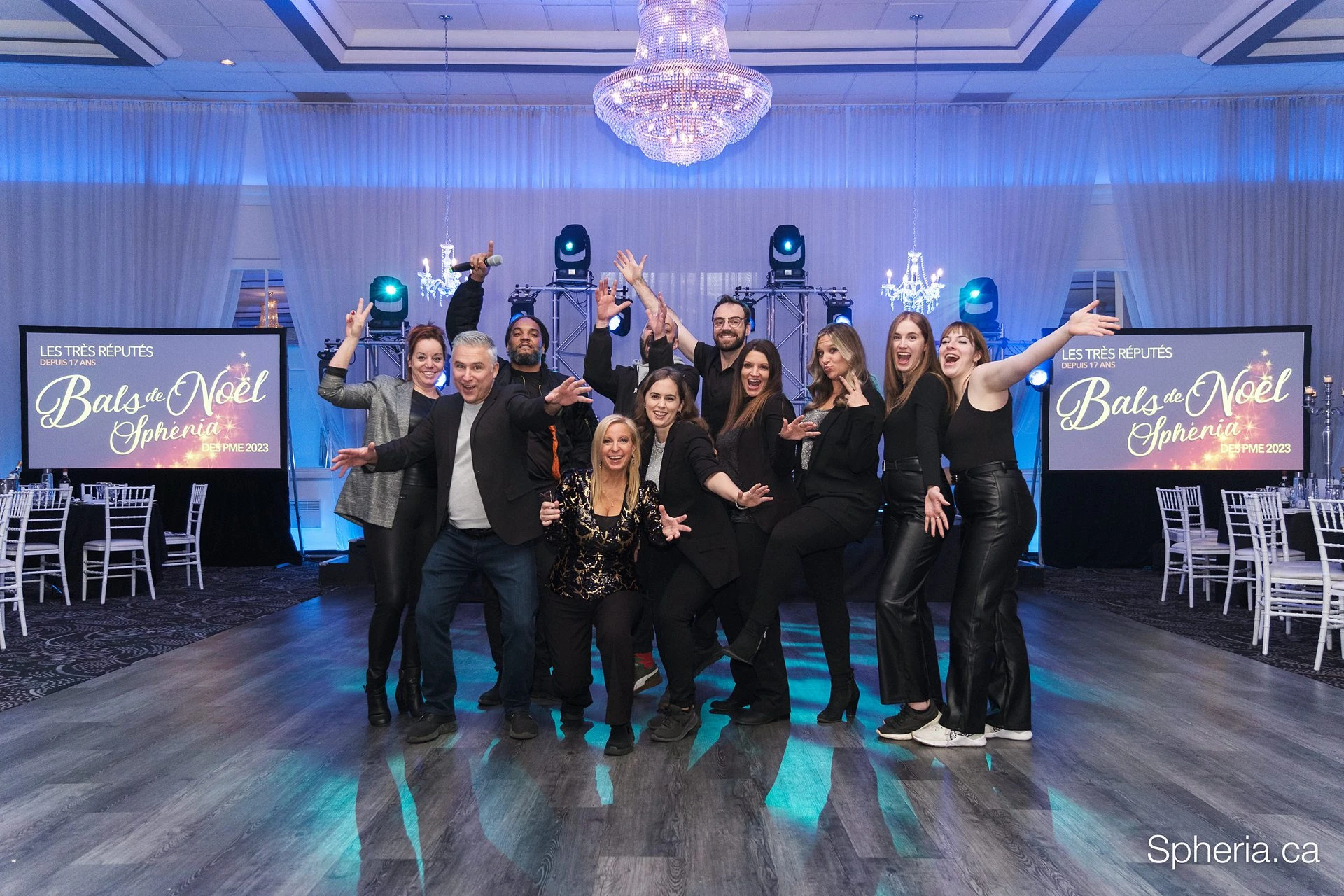 Guests gathered in front of the stage at a Christmas party