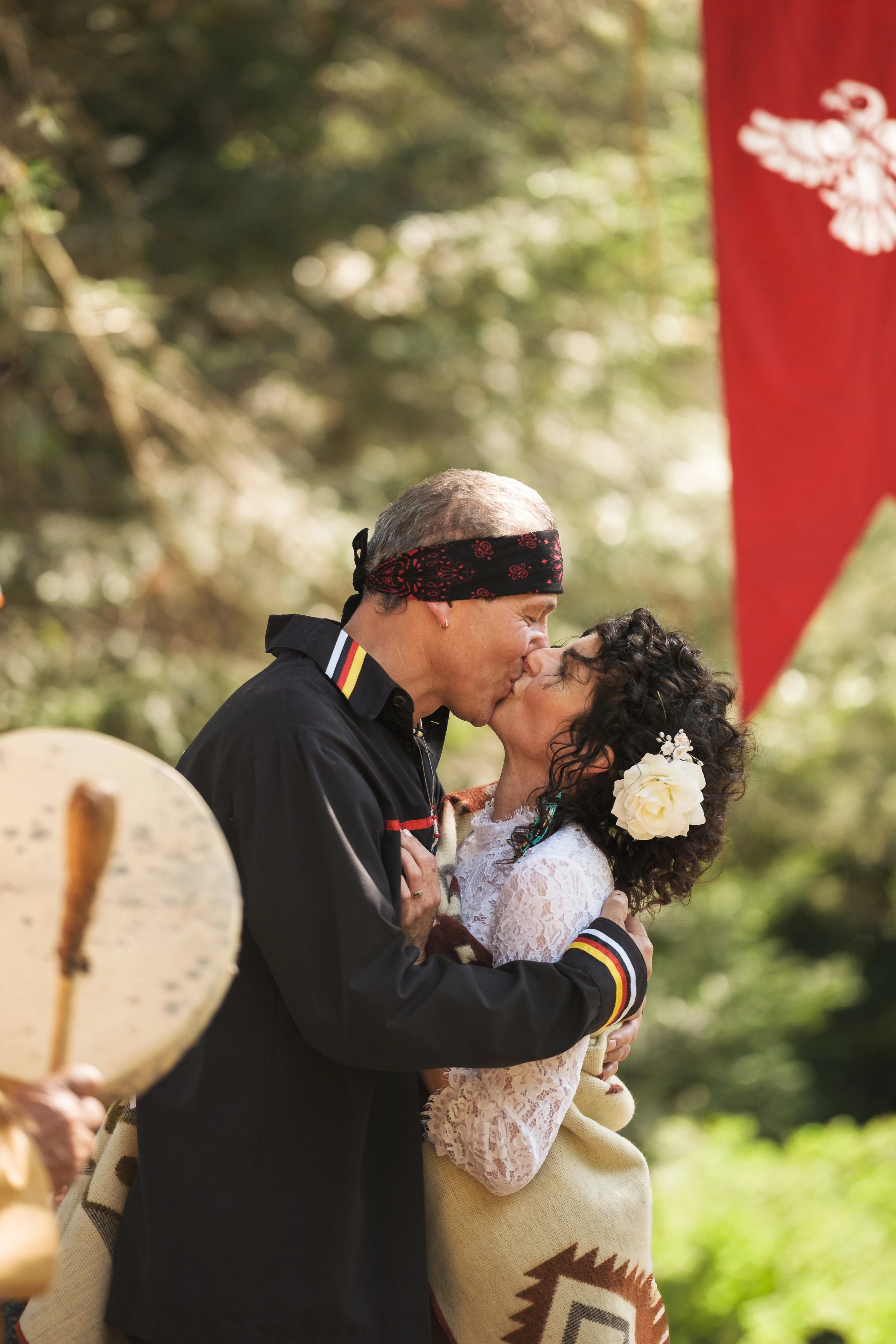 David photographs a couple outdoors, attentive to the moment unfolding in front of him