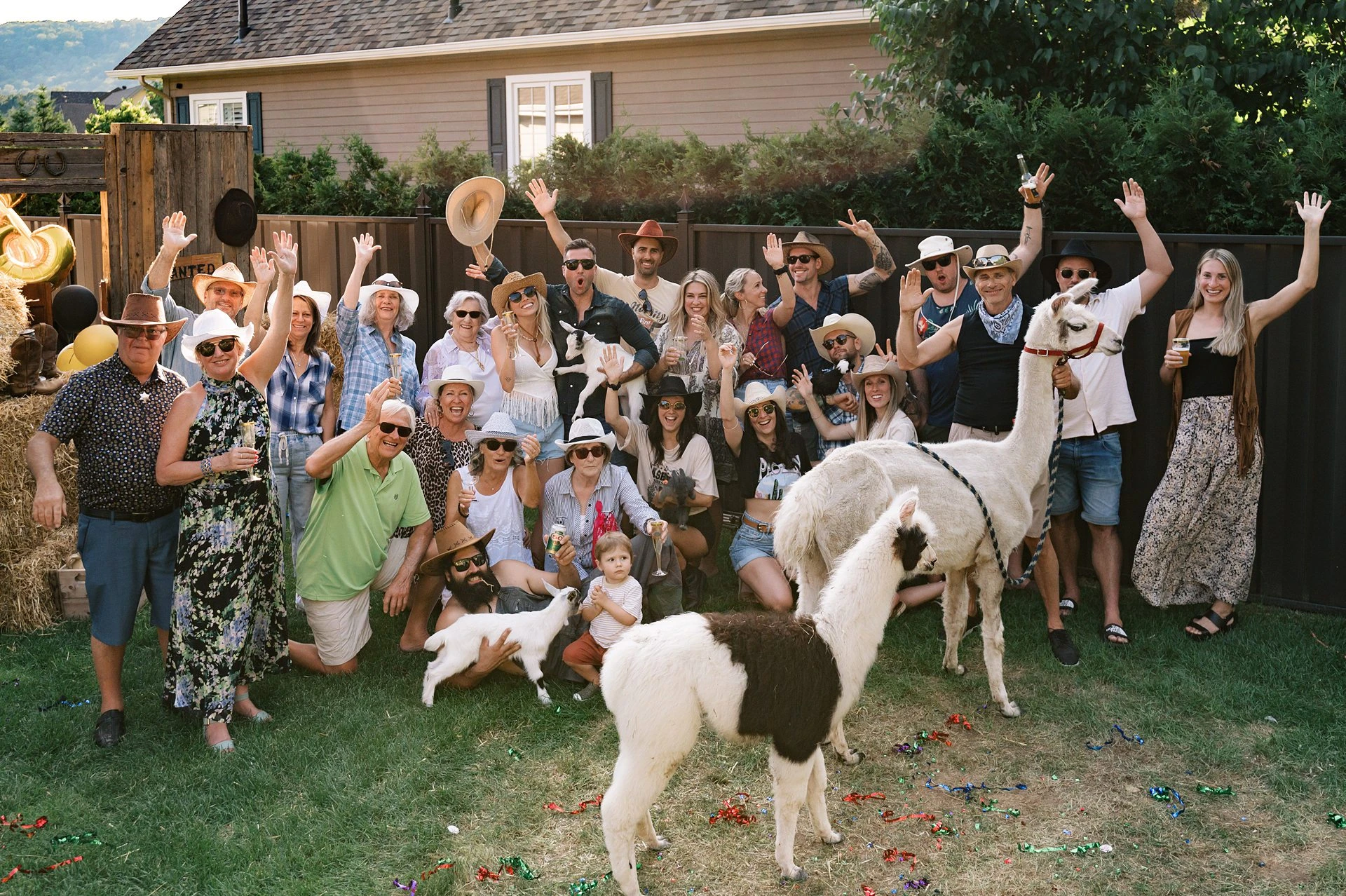 Costumed guests gathered in a garden for a celebration