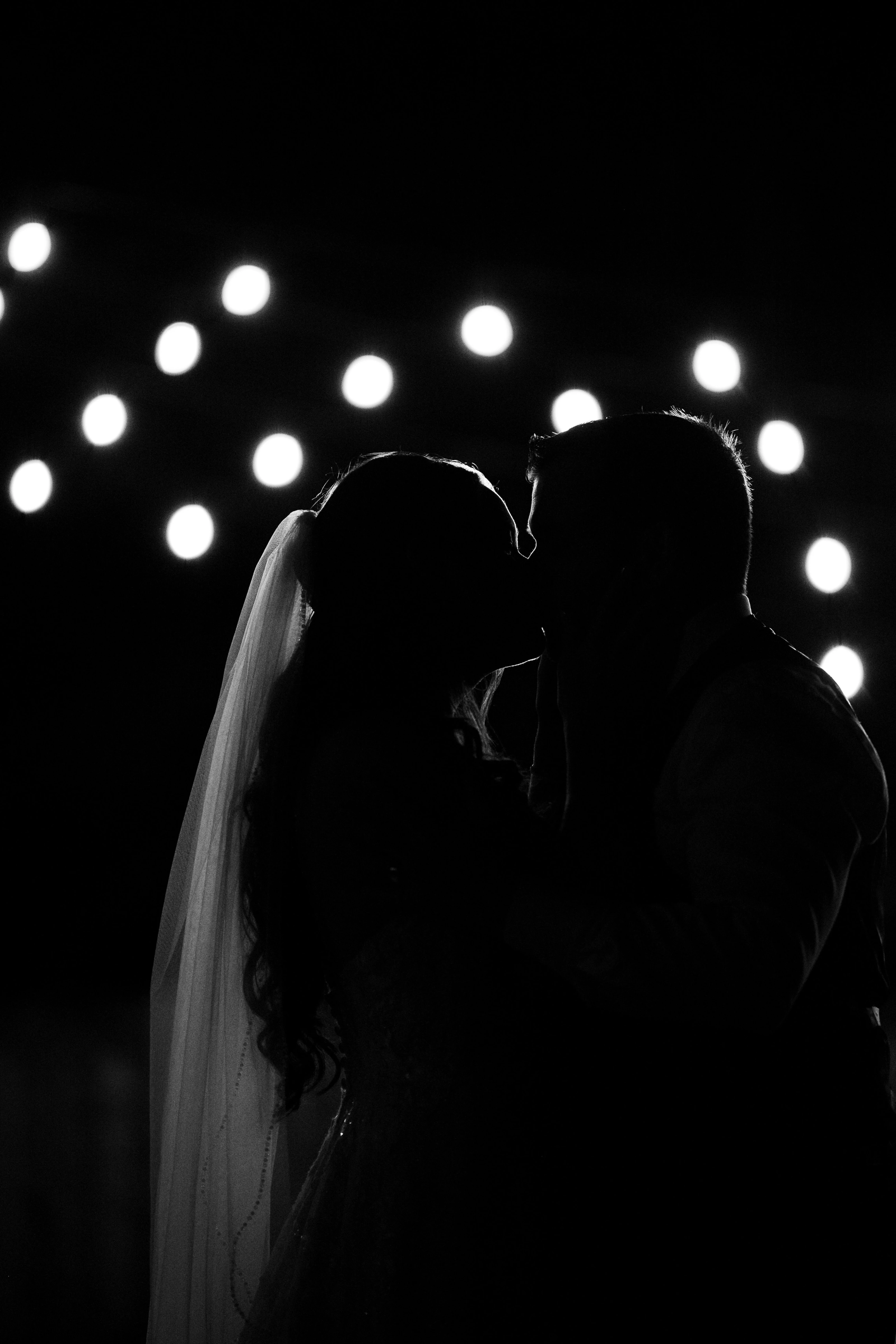 The bride walks with her bouquet, a quiet detail captured during the preparations