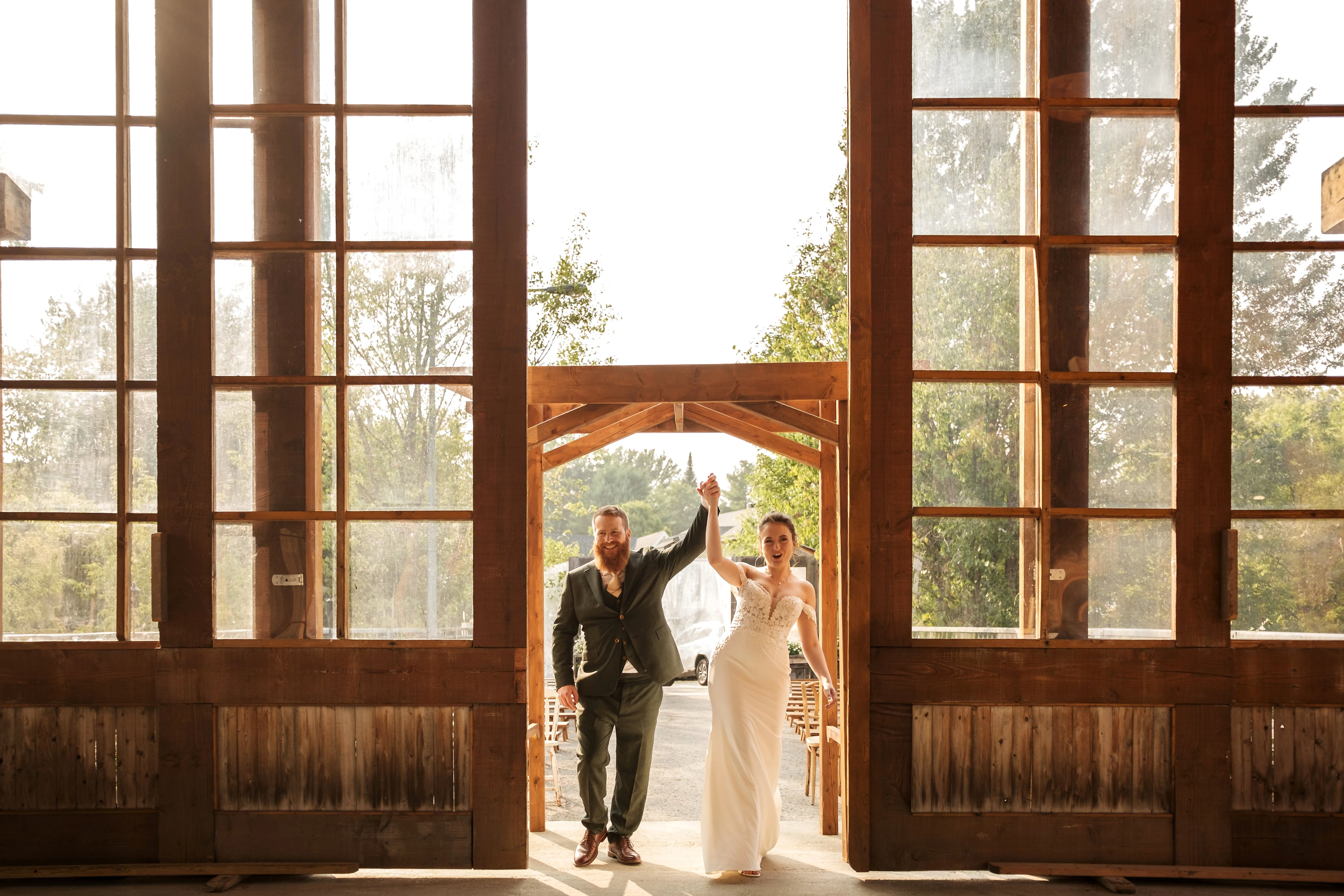 The newlyweds open champagne in the middle of a lively reception